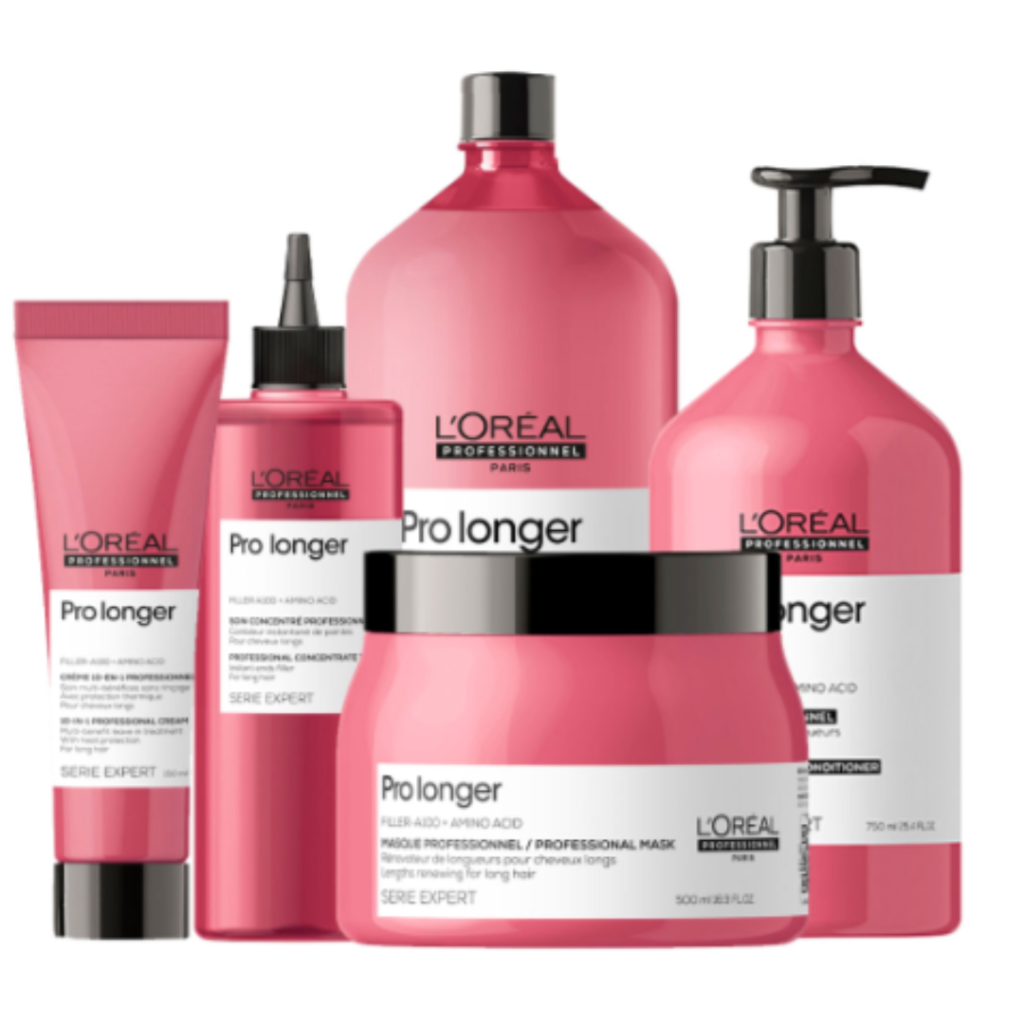 Conjunto de productos L'Oréal Professionnel Pro Longer, diseñados para fortalecer y alargar el cabello. Incluye champú, acondicionador, mascarilla y tratamiento concentrado en envases rosados con detalles negros y blancos.