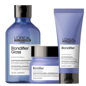 L'Oréal Professionnel Blondifier: Iluminación y Cuidado para Cabello Rubio Pack de productos L'Oréal Professionnel Blondifier, formulados con polifenoles de açaí para nutrir e iluminar el cabello rubio o con mechas. Incluye champú, mascarilla y acondicionador en envases azules con detalles negros y blancos, diseñados para restaurar el brillo y suavidad del cabello.